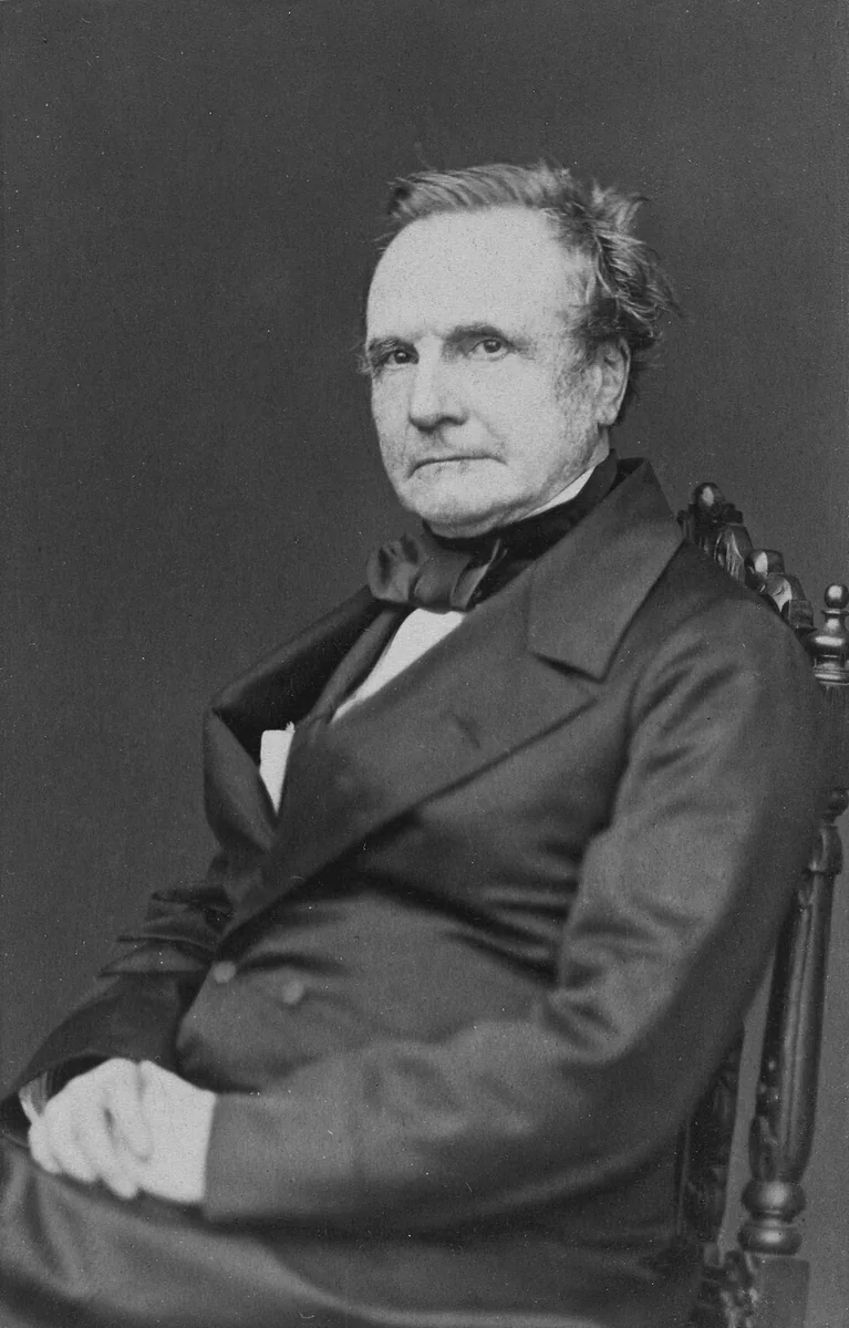 Black-and-white photographic portrait of Charles Babbage seated, circa 1860